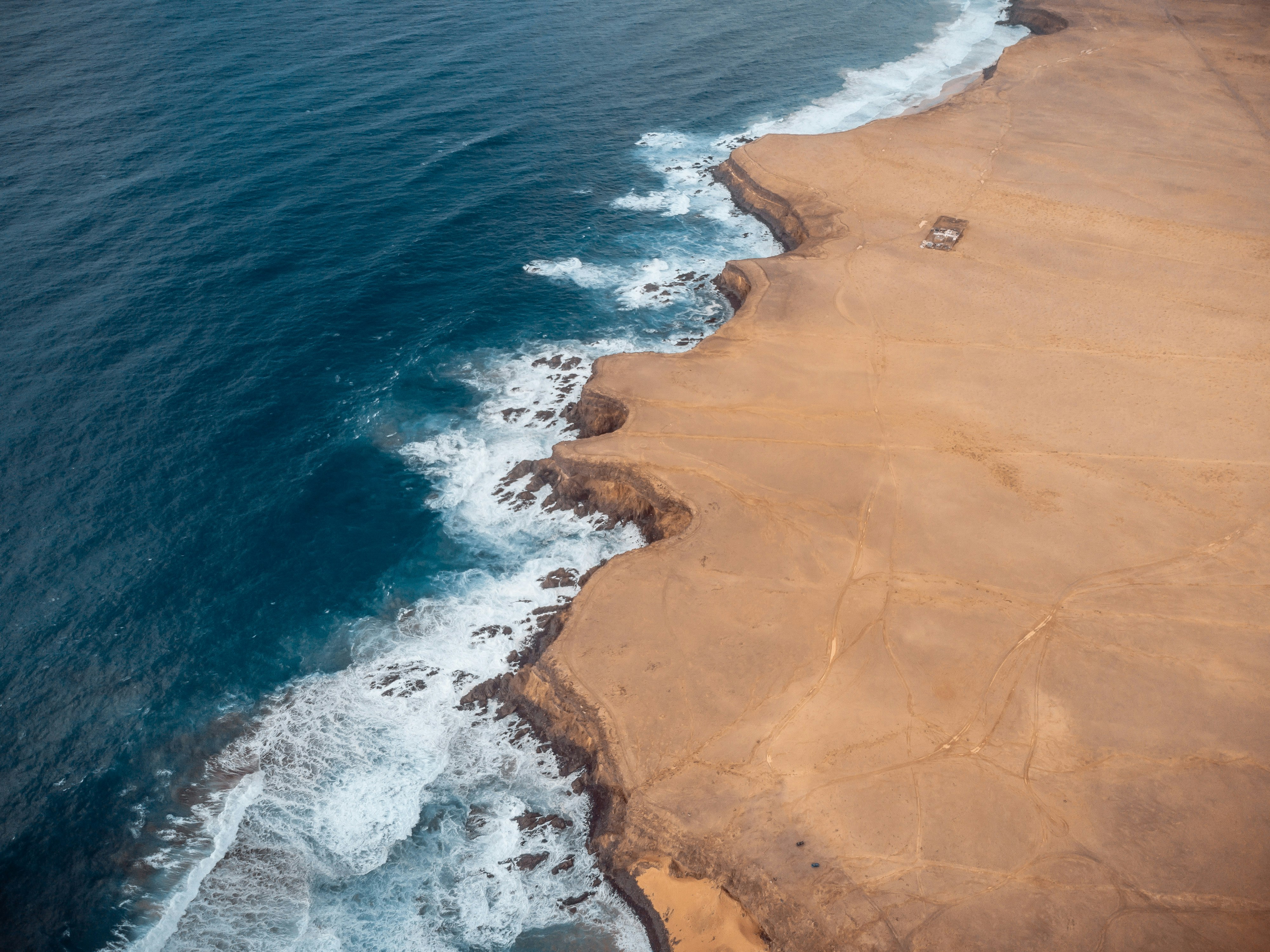 aerial view of brown sand beach